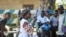 Katungo Methya, 53, who volunteers for the Red Cross educating the public about epidemics, talks about coronavirus prevention in Beni, eastern Congo, April 7, 2020.