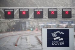 A closed road and the logo of the Port of Dover is seen at the port as EU countries impose a travel ban from the UK following the coronavirus disease outbreak, in Dover, Britain, Dec. 21, 2020.