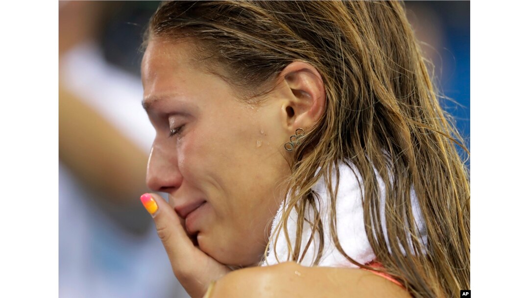 Russia's Yulia Efimova cries after placing second in the women's 100-meter breaststroke final during the swimming competitions at the 2016 Summer Olympics, Monday, Aug. 8, 2016.