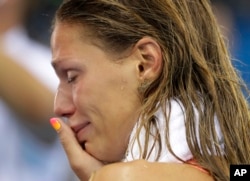 Russia's Yulia Efimova cries after placing second in the women's 100-meter breaststroke final during the swimming competitions at the 2016 Summer Olympics, Monday, Aug. 8, 2016.