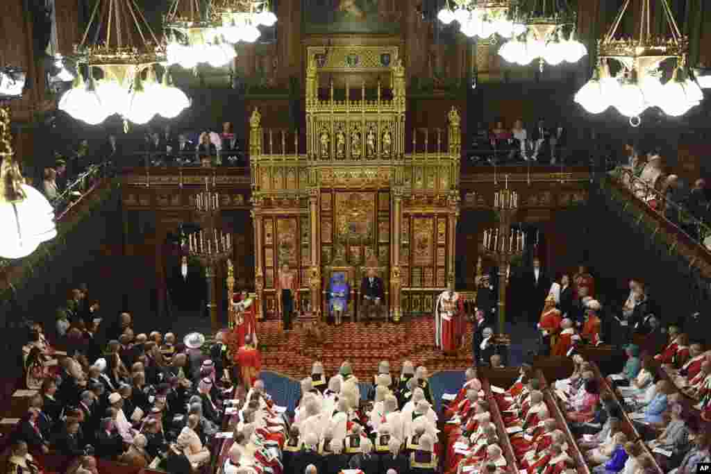 Britain's Queen Elizabeth II and Prince Charles sit in the House of Lords at the official State Opening of Parliament in London.