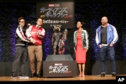 Director James Gunn (from left) actors Chris Pratt, Zoe Saldana and Dave Bautista pose for photographers during a media conference of "Guardians of the Galaxy Vol. 2" in Tokyo, April 11, 2017.