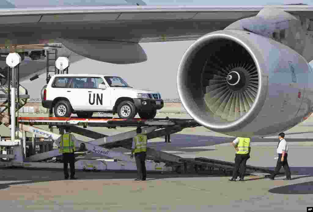 A vehicle for the U.N. observers is offloaded from a plane at the Damascus airport in Syria, May, 8, 2012.