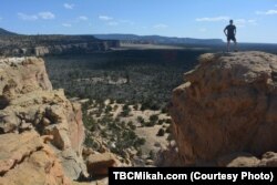 National parks traveler Mikah Meyer says he felt like a child scrambling among the boulders at El Malpais National Monument.