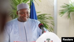 FILE - Gambia's President Adama Barrow is seen during a news conference in his residence in Banjul, Jan. 28, 2017. Barrow hopes to bring order to his nation's fishing sector.