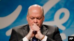 FILE - Ford Motor Company CEO Jim Hackett listens to a question in Dearborn, Michigan, May 22, 2017.