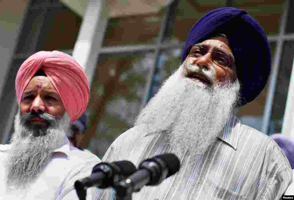 Mohan Singh Khatra (R), who lost his uncle Subeg Singh Khatra in the shootings, speaks to the media outside the Sikh Cultural Society in Queens, New York, August 6, 2012.