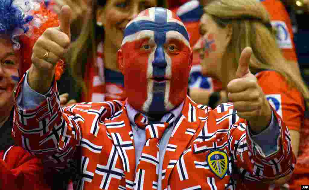 A supporter of Norway cheers up his team during the IHF Women&rsquo;s World Championship handball final match between France and Norway in Hamburg, nothern Germany.