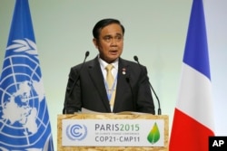 Thailand's Prime Minister Prayuth Chan-Ocha addresses world leaders at the COP21, United Nations Climate Change Conference, in Le Bourget, outside Paris, Nov. 30, 2015.