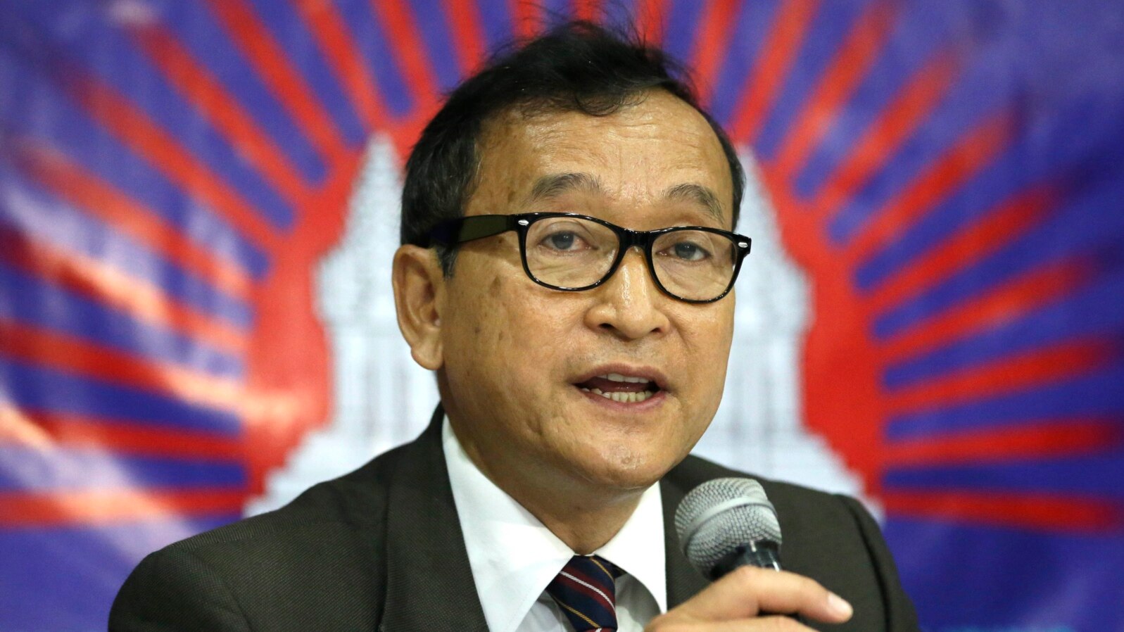 Cambodian opposition leader Sam Rainsy, who is currently living in exile in France, talks about the opposition's plans for next year's elections in Cambodia in San Juan, east of Manila, Philippines, Sept. 10, 2012. 