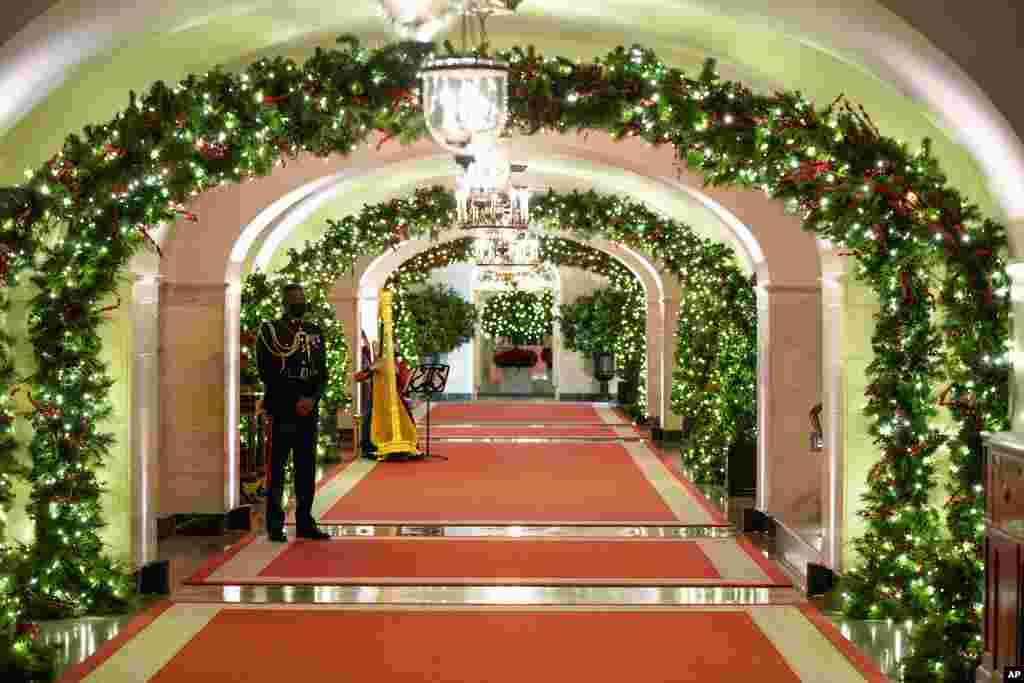 The Center Hall of the White House is decorated for the holiday season during a press preview of the White House holiday decorations, Nov. 29, 2021.