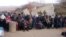 Syrians wait for the arrival of an aid convoy, Jan. 11, 2016, in the besieged town of Madaya as part of a landmark six-month deal reached in September for an end to hostilities in those areas in exchange for humanitarian assistance.
