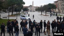 FILE - Authorities secure the area around the Obelisk of Theodosius at Sultanahmet Square in Istanbul, Turkey, Jan. 13, 2016. Turkish authorities detained three Russian nationals suspected of IS links following a suicide bomb attack in the square that killed 10 tourists.