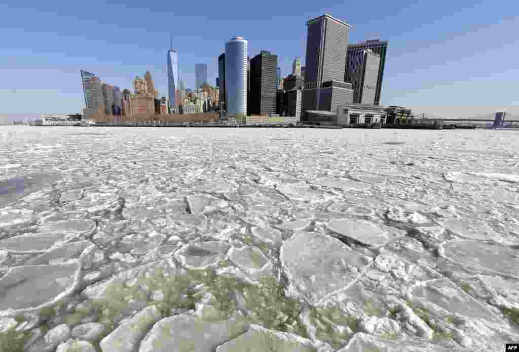 A view of Lower Manhattan from the Staten Island ferry as the New York Harbor is filled with large chunks of ice. Heavy ice in the East River shut down commuter ferry service between Manhatta, Queens, and Brooklyn on Feb. 24, 2015.