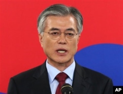 FILE - Democratic United Party's Moon Jae-in speaks during a press conference.