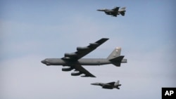 A U.S. Air Force B-52 bomber flies over Osan Air Base in Pyeongtaek, South Korea, Jan. 10, 2016. The U.S. flew two B-52 bombers over the South China Sea Tuesday to discourage China from militarizing the Spratly archipelago.