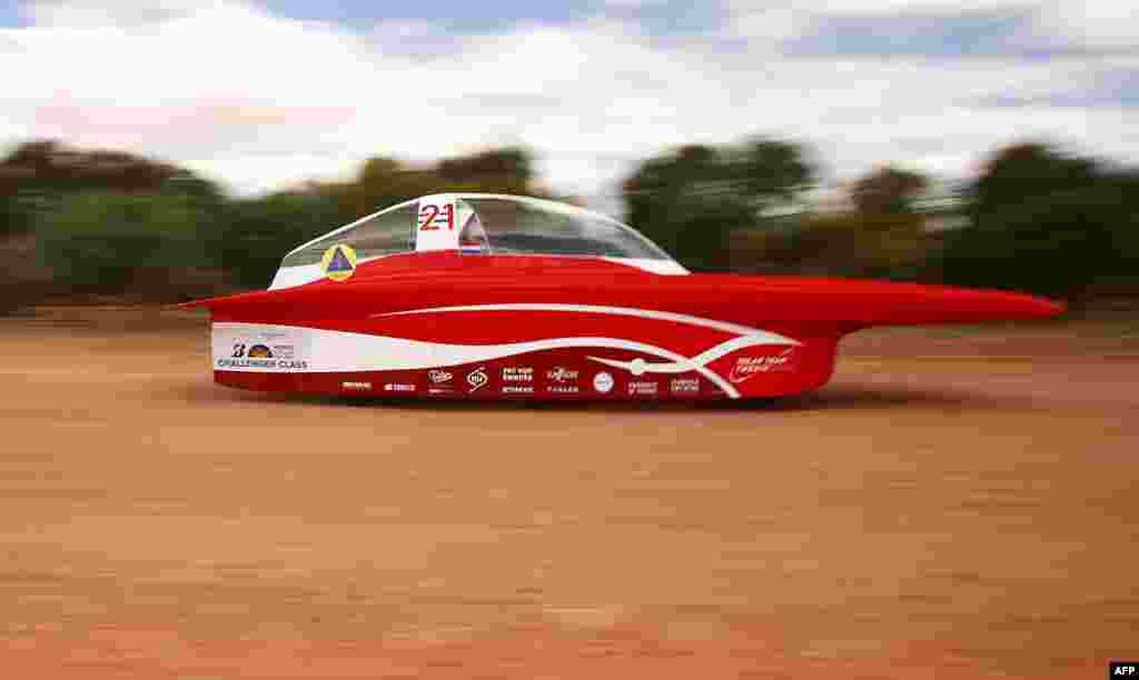 This handout from the World Solar Challenge shows the Solar Team Twente vehicle &quot;RED Shift&quot; of Netherland in action near Coober Pedy on the fourth day of racing. The World Solar Challenge, an epic 3,000-kilometer (1,860-mile) solar car race across outback Australia, has become one of the world&rsquo;s foremost innovation challenges with teams looking to demonstrate designs that could one day lead to solar-powered cars for consumers that can carry passengers.