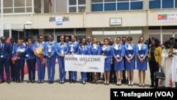 Eritrean Airline flight attendants greet the arrivals.