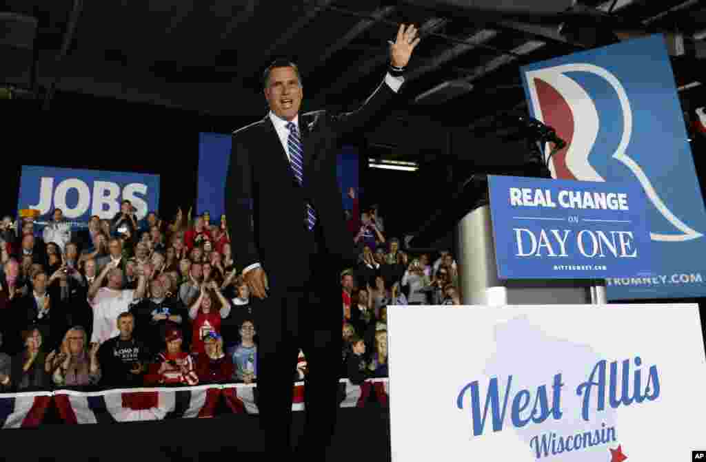 Republican presidential candidate, former Massachusetts Gov. Mitt Romney waves to supporters as he arrives for a campaign stop at the Wisconsin Products Pavilion at State Fair Park in West Allis, Wis., November 2, 2012.