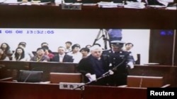 An internal court video shows British investigator Peter Humphrey arriving at a courtroom after a lunch break, during his trial at Shanghai No.1 Intermediate People's Court, August 8, 2014.