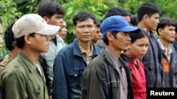 FILE - A group of Montagnards are seen after they emerged from a dense forest some 70 kilometers northeast of Ban Lung, in Ratanakiri, Cambodia, July 2004.