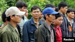 FILE - A group of Montagnards are seen after they emerged from a dense forest some 70 km (44 miles) northeast of Ban Lung, located in Cambodia's northeastern province of Ratanakiri, on July 22, 2004.