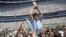 In this June 29, 1986 file photo, Diego Maradona holds up his team's trophy after Argentina's 3-2 victory over West Germany at the World Cup final soccer match at Atzeca Stadium in Mexico City. (AP)