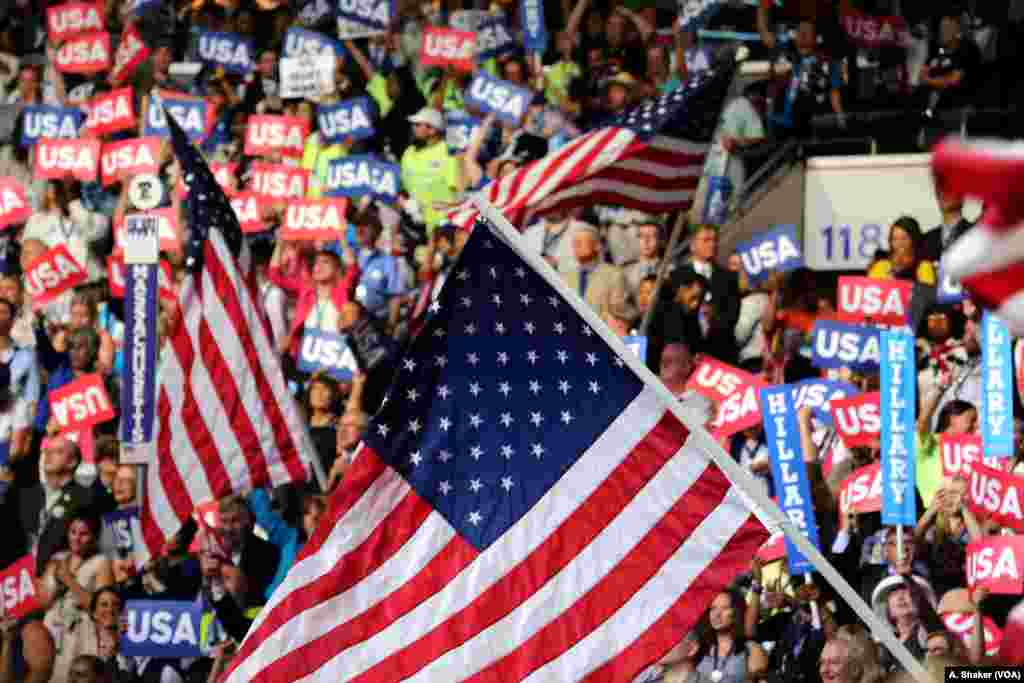 An American flag waves at the Wells Fargo Arena in Philadelphia on the final night of the Democratic National Convention, July 28, 2016. (A. Shaker/VOA)