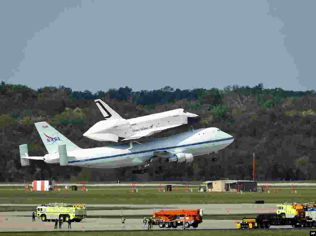 The space shuttle Enterprise departs from Dulles International Airport in Virginia, April 27, 2012. The Enterprise, atop a NASA 747 transport jet, is en route to New York City where it will go on display later this year. (Reuters) 