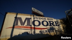 A banner promoting Republican Senatorial candidate Roy Moore is pictured on the side of a building in Birmingham, Alabama, U.S., December 10, 2017.