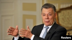 Colombia's outgoing President Juan Manuel Santos speaks with Reuters at the presidential palace, in Bogota, Colombia, July 30, 2018. 