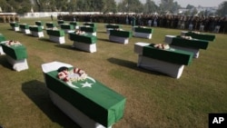 People offer funeral prayers of Saturday's NATO attack victims in Peshawar, Pakistan, November 27, 2011.