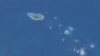 Ảnh đảo Ba Bình chụp từ Trạm không gian Quốc tế. Ba Bình là hòn đảo lớn nhất thuộc quần đảo Trường Sa, nằm cách Cao Hùng phía Nam Đài Loan chừng 1600 cây số về hướng Tây Nam. 