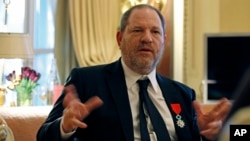 FILE - U.S. movie mogul Harvey Weinstein is seen during an interview in Paris, March 7, 2012, the same day he was named Chevalier of the Legion of Honor by then French president Nicolas Sarkozy.