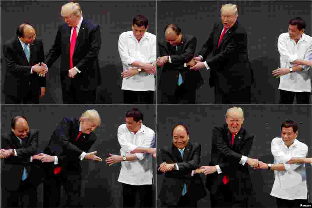 Foto Presiden AS Donald Trump bergandengan tangan dengan PM Vietnam Nguyen Xuan Phuc dan Presiden Filipina Rodrigo Duterte, dalam tradisi salaman &quot;ASEAN&quot; pada KTT ASEAN di Manila, Filipina.