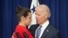FILE - Vice President Joe Biden consoles Madeleine Smith after she recounted her story of being a rape victim while a student at Harvard University.