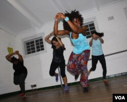 Vera Ephraim and her students demonstrate a West African 'harvesting dance' in Johannesburg, South Africa. (Photo: Darren Taylor for VOA)