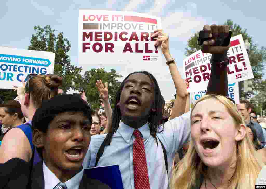 Supporters of the Affordable Healthcare Act celebrate in front of the Supreme Court after the court upheld the legality of the law.