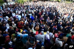 People attend the funerals of victims on Saturday's bombing attacks, in Istanbul, Oct. 12, 2015.