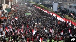 Supporters of Shiite Houthi rebels attend a rally in Sanaa, Yemen, Tuesday, Dec. 5, 2017. The killing of Yemen's ex-President Ali Abdullah Saleh by the country's Shiite rebels on Monday, as their alliance crumbled, has thrown the nearly three-year civil w