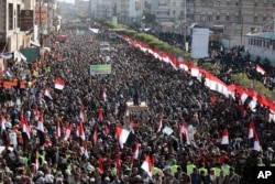 Supporters of Shiite Houthi rebels attend a rally in Sanaa, Yemen, Tuesday, Dec. 5, 2017. The killing of Yemen's ex-President Ali Abdullah Saleh by the country's Shiite rebels on Monday, as their alliance crumbled, has thrown the nearly three-year civil w