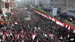 Supporters of Shiite Houthi rebels attend a rally in Sanaa, Yemen, Tuesday, Dec. 5, 2017. The killing of Yemen's ex-President Ali Abdullah Saleh by the country's Shiite rebels on Monday, as their alliance crumbled, has thrown the nearly three-year civil war into unpredictable new chaos.