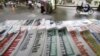 State-run newspapers are displayed for sale on a street in Hanoi, Vietnam, September 26, 2015. 