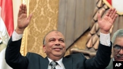 Newly elected speaker of the Egyptian parliament, Saad el-Katatni of the Muslim Brotherhood, salutes during the first session of the newly-elected assembly in Cairo, January 23, 2012