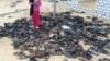FILE - Discarded shoes of victims remain outside al-Rawdah mosque in Bir al-Abed, northern Sinai, Egypt, a day after attackers killed hundreds of worshippers, Nov. 25, 2017.