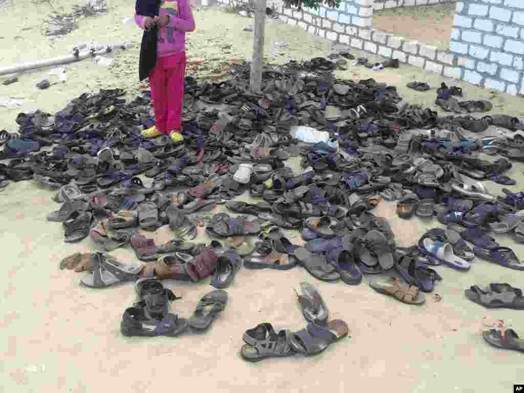 Shoes of victims remain outside al-Rawdah mosque in Bir al-Abed, northern Sinai, Egypt, a day after attackers killed hundreds of worshippers, Nov. 25, 2017.