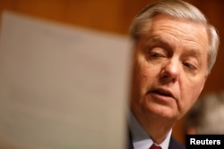 FILE - Chairman Sen. Lindsay Graham (R-SC) reads a letter on Capitol Hill in Washington, March 15, 2017.