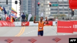 Ethiopia's Seifu Tura Abdiwak reacts as he wins the Elite Men's 2021 Bank of America Chicago Marathon on Oct. 10, 2021 in Chicago, Illinois.
