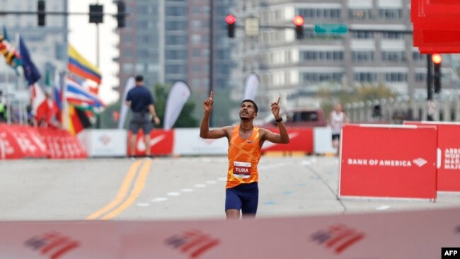 Ethiopia's Seifu Tura Abdiwak reacts as he wins the Elite Men's 2021 Bank of America Chicago Marathon on Oct. 10, 2021 in Chicago, Illinois.