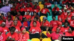 People wearing red gather for a prayer vigil for the release of abducted secondary school girls in the remote village of Chibok in Lagos, May 27, 2014. 